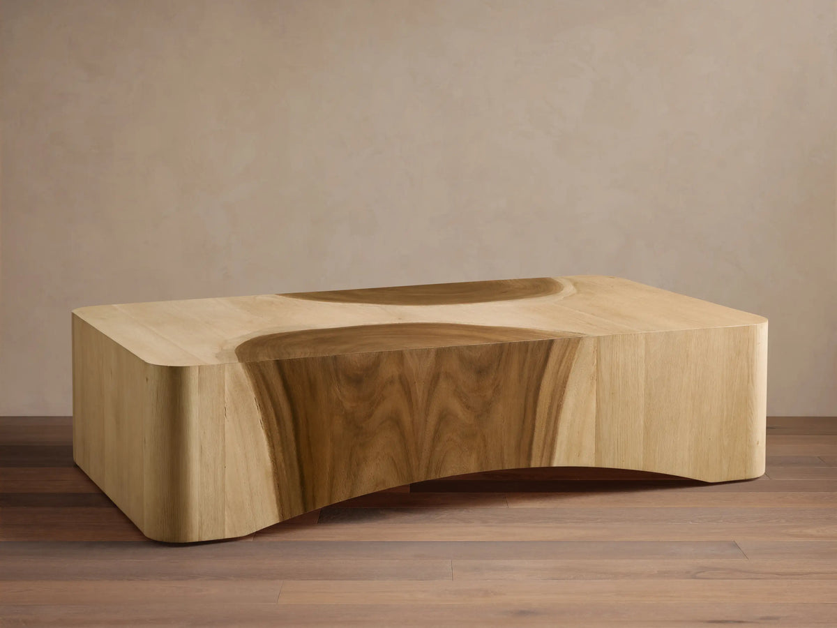 Ramiro Coffee Table: light oak wood, low rectangular shape, dark curved Guanacaste wood inlays, and curved base.