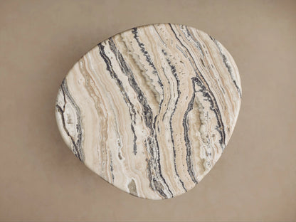 Rune End Table with a polished, round marble top featuring intricate beige and brown veining, supported by thick, carved wooden legs.