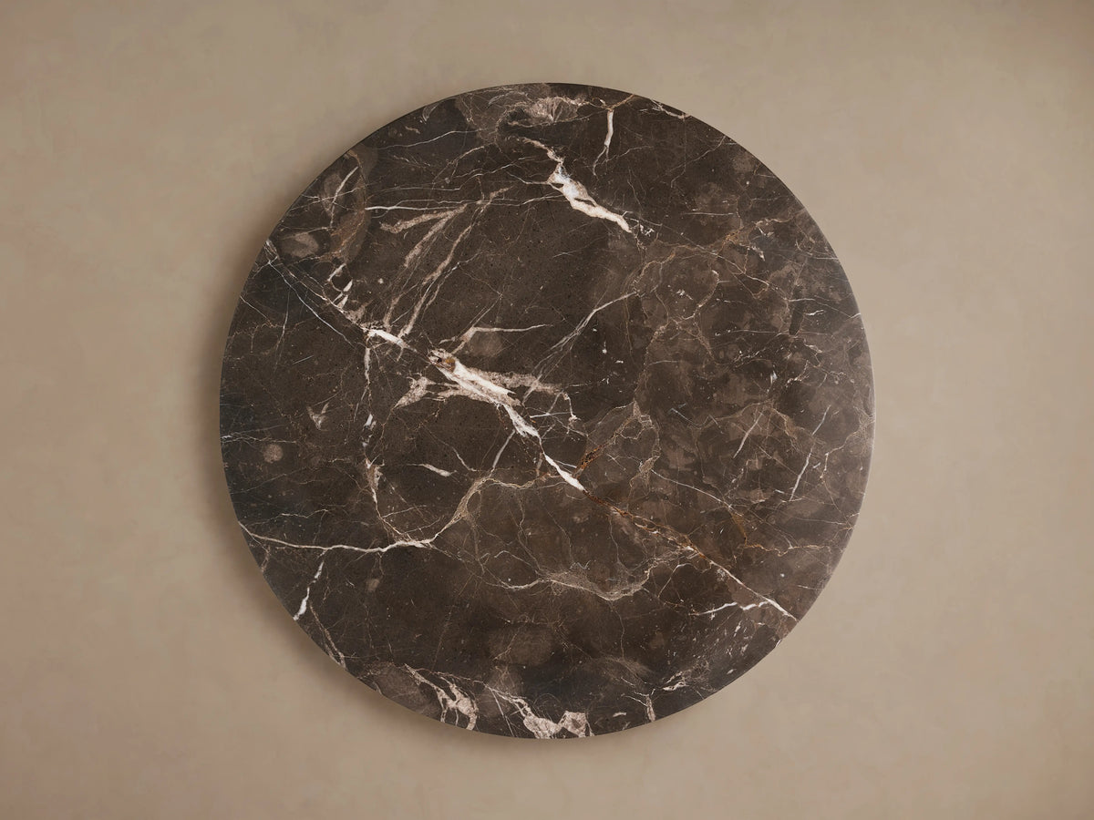 Round Solstice End Table top in dark Espresso Marble with natural white veining, offering a smooth and polished surface.