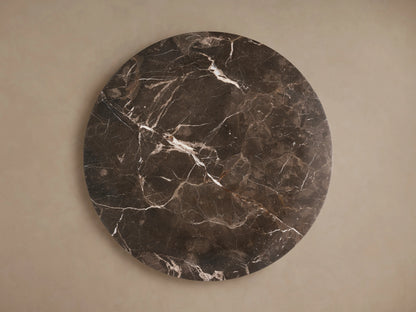 Round Solstice End Table top in dark Espresso Marble with natural white veining, offering a smooth and polished surface.
