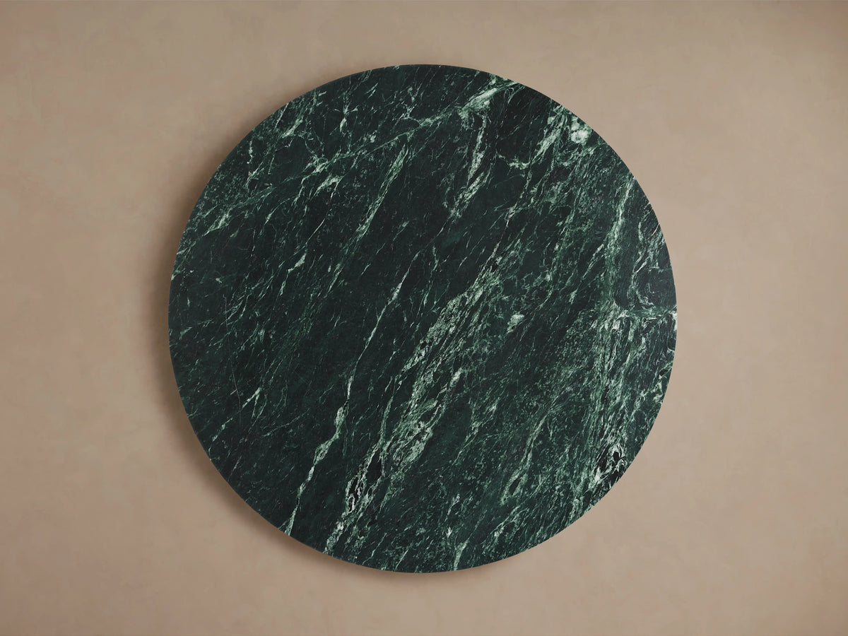 Solstice End Table in green marble; round top with unique three-piece intersecting base, crafted in artisan style.