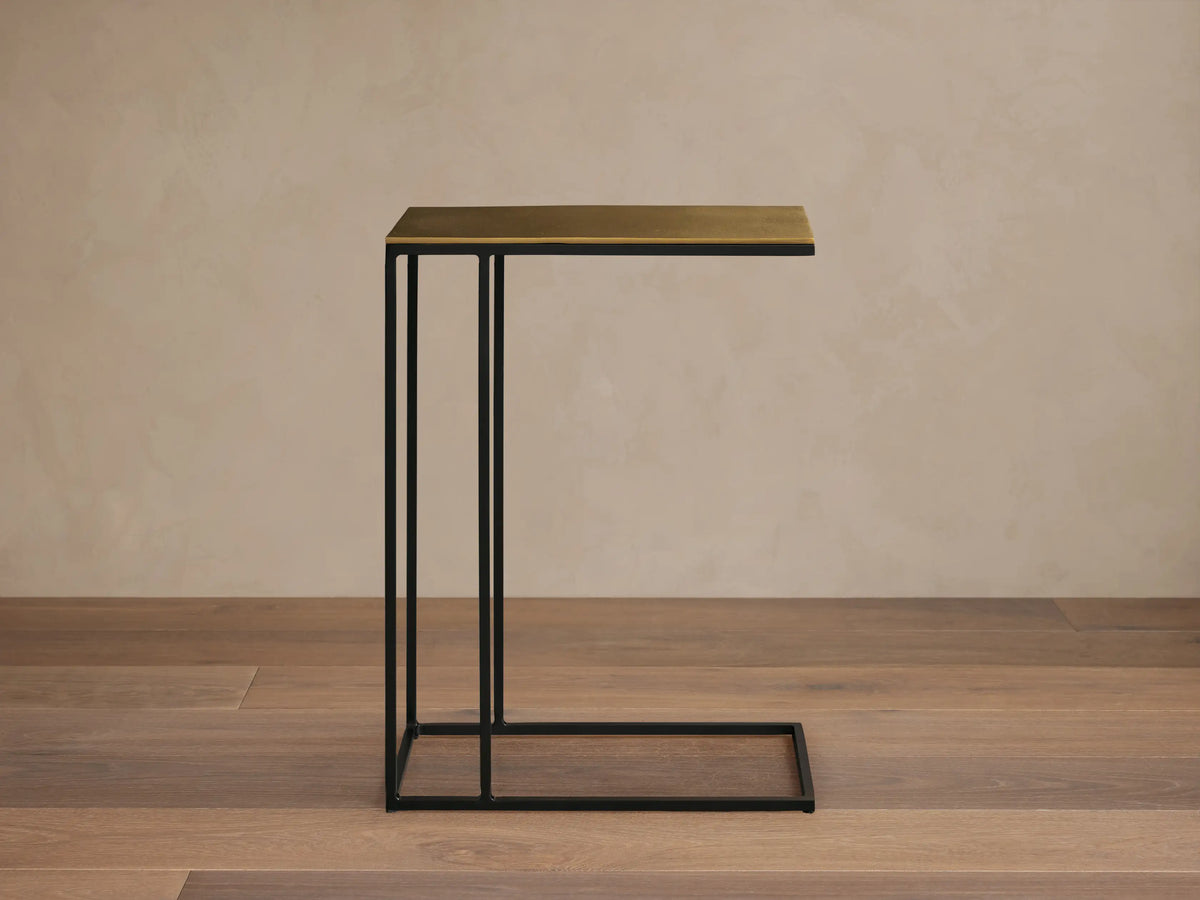 Top-down view of the golden patinaed rectangular tabletop of the Soma C Table, showcasing its textured finish.