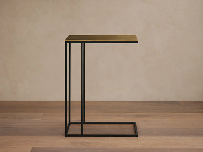 Top-down view of the golden patinaed rectangular tabletop of the Soma C Table, showcasing its textured finish.