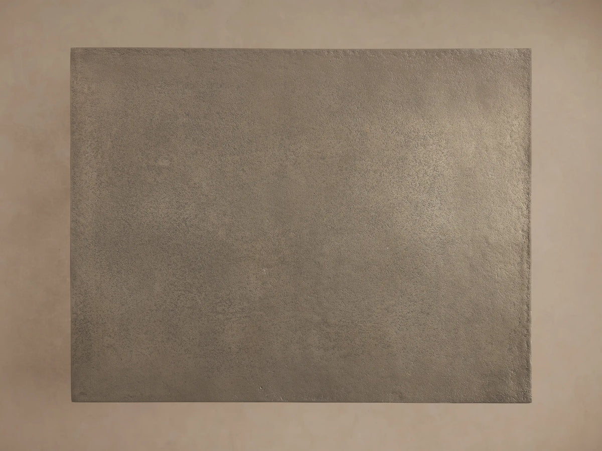 Soma Wide C Table: close-up of rectangular, textured metallic grey top & black powder-coated frame, angled view.