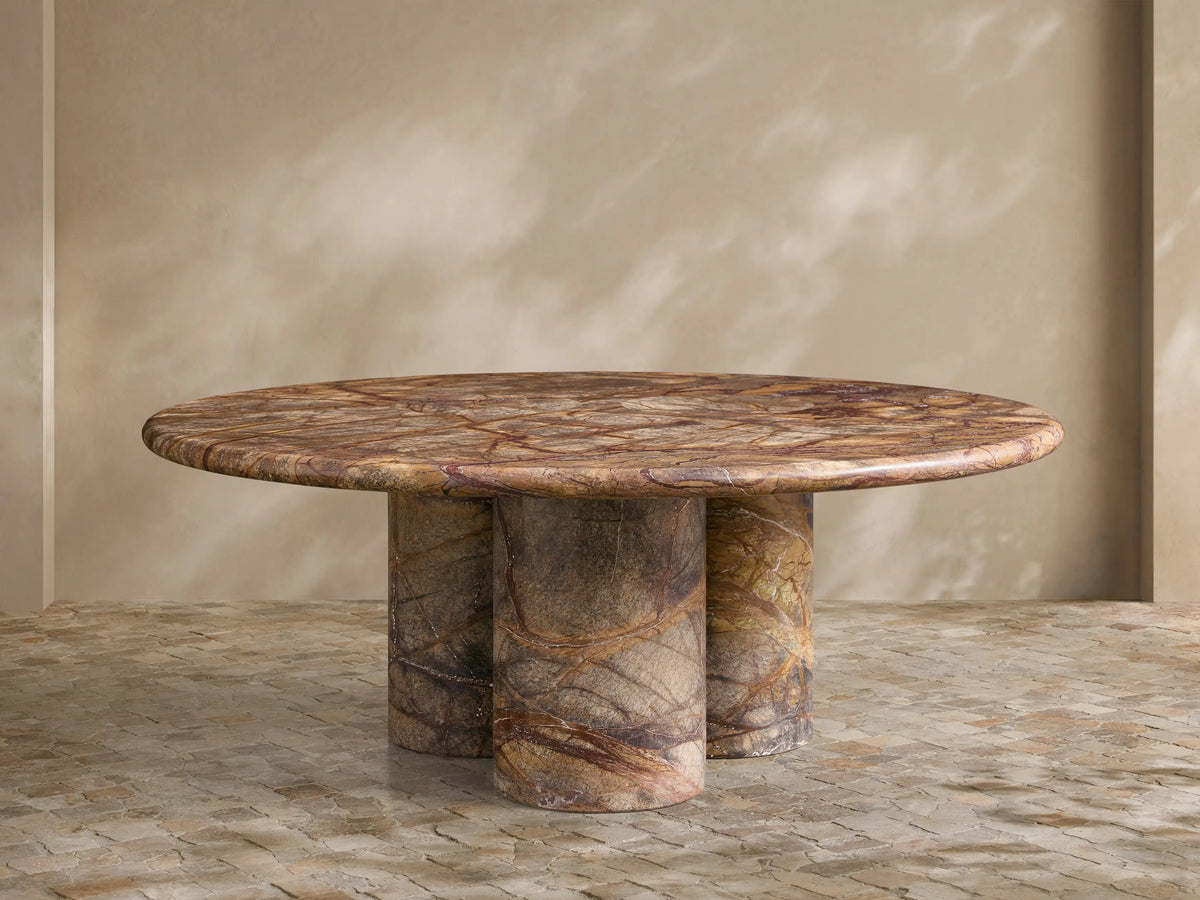 Top-down view of the circular Serafin Coffee Table with a brown, gray, and reddish-brown natural marble pattern.