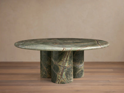 Front view of the green marble Serafin Coffee Table with a round top and three cylindrical legs, featuring natural veining.