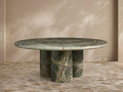 Front view of the round green marble Serafin Coffee Table with three cylindrical legs.