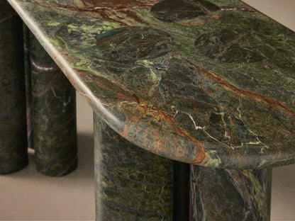 Front view of a console table with a mottled green and brown oval marble top, supported by two sets of three cylindrical legs.