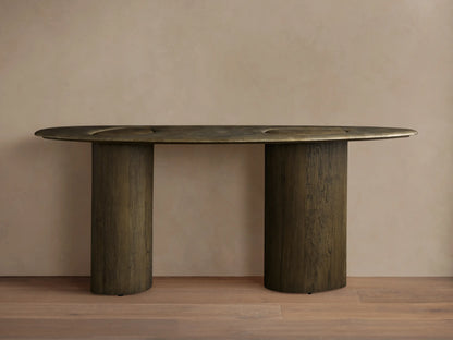 Sucurro Console Table: Dark oval oxidized aluminum top with recessed shapes & dimples, two thick cylindrical spalted wood bases.
