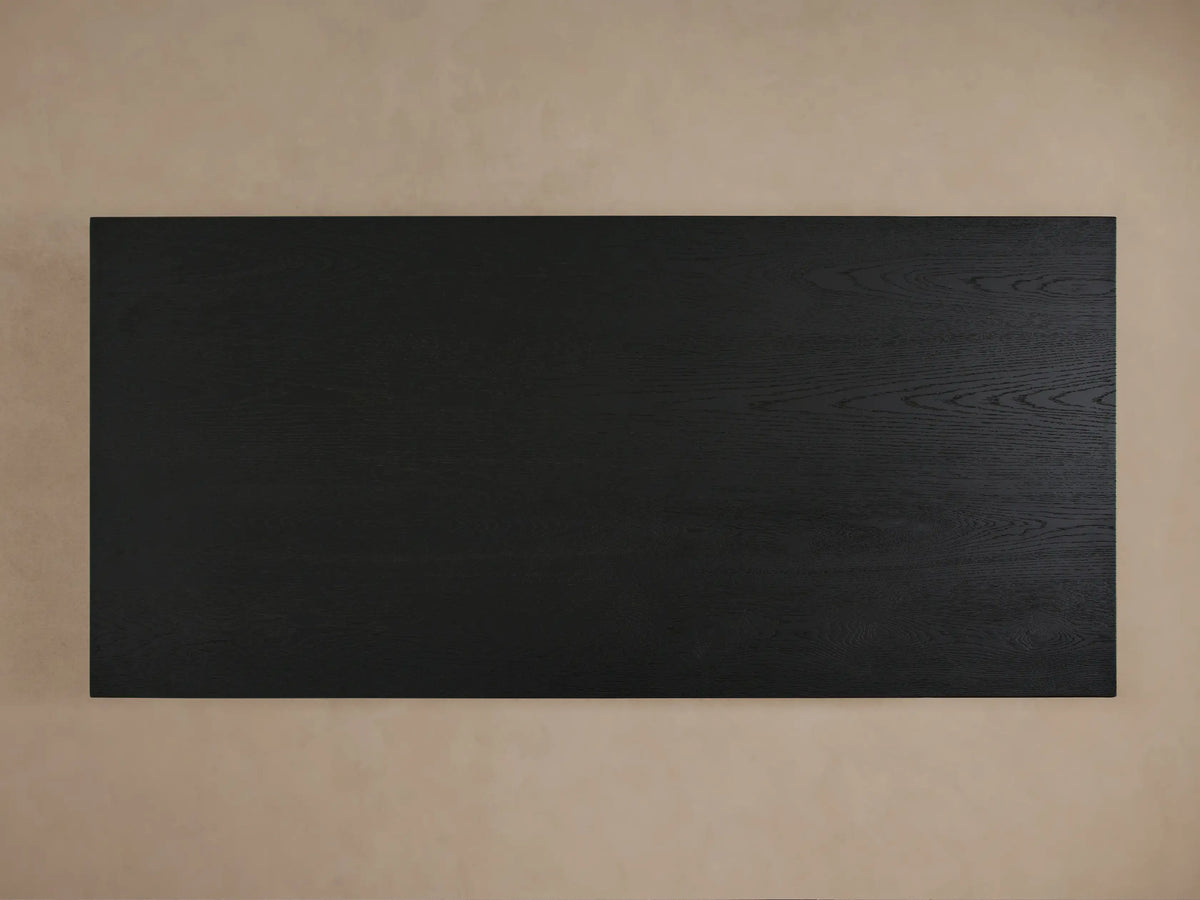 Sullivan Waterfall Coffee Table made from dark oak, featuring a seamless miter joinery waterfall edge and visible wood grain details.