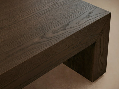 Sullivan Waterfall Coffee Table made of dark European oak with visible grain patterns, featuring a seamless waterfall design from top to sides.