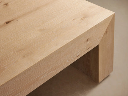 Sullivan Waterfall Coffee Table made of light oak wood with visible grain and mitered sides creating a continuous flow.