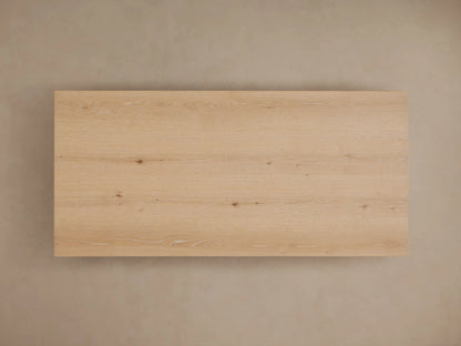 Sullivan Waterfall Coffee Table with natural oak grain, miter joinery showing a seamless top to side flow, and organic wood features.