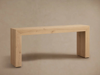 Sullivan Console Table in a light oak finish, showcasing waterfall edges and natural wood grain, topped with a vase and book.