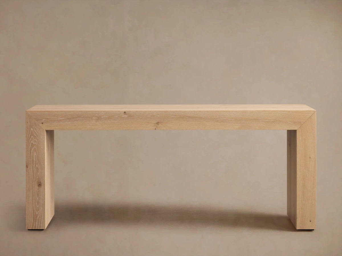Sullivan Console Table in light wood, showcasing glossy finish and miter joinery with visible natural grain and small knots.