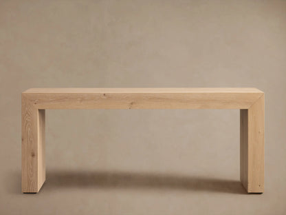 Sullivan Console Table in light wood, showcasing glossy finish and miter joinery with visible natural grain and small knots.
