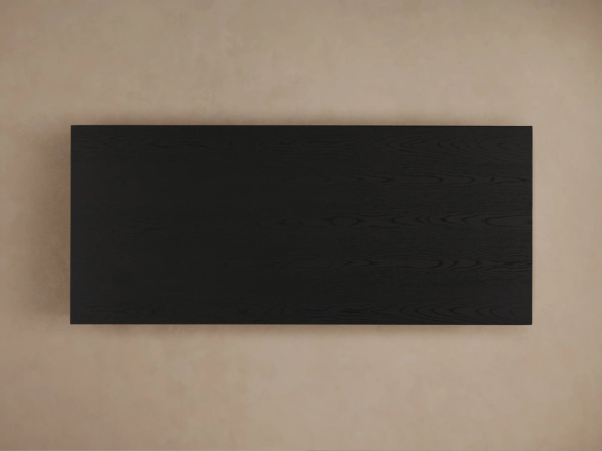Sullivan Storage Coffee Table with black oak veneer, showing open drawer with soft-close mechanism and visible wood grain texture.