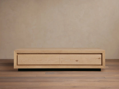 Sullivan Storage Coffee Table made of natural European oak with visible cracks and knots, on a black plinth base, front view.