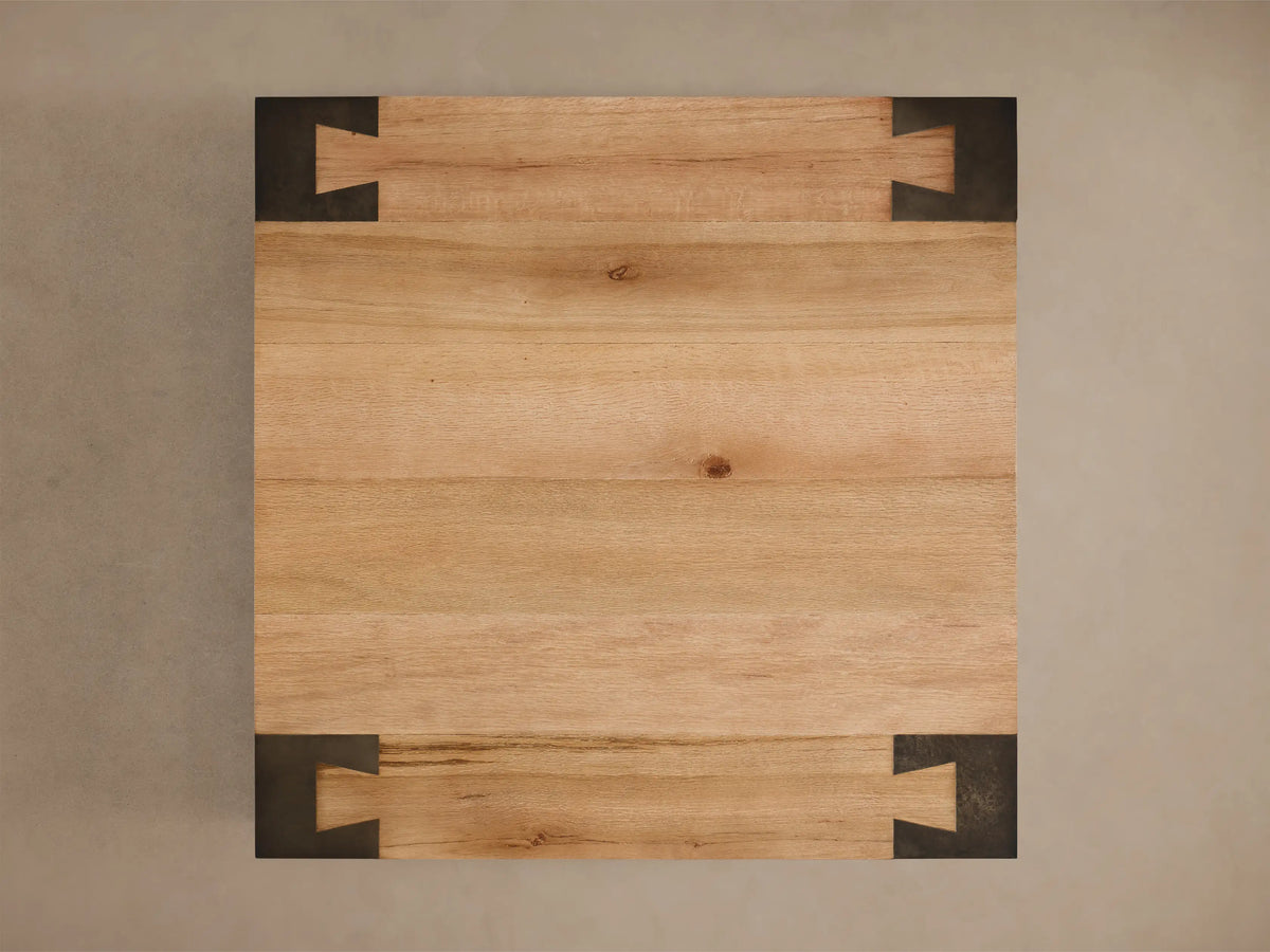 Front view of the Telluride Square Coffee Table, with a light oak veneer top and square naturally oxidized steel legs.