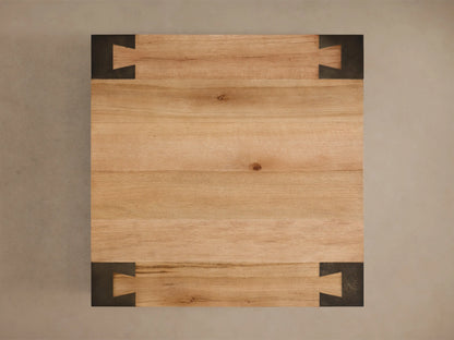 Front view of the Telluride Square Coffee Table, with a light oak veneer top and square naturally oxidized steel legs.