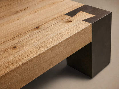 Top-down view of the Telluride Square Coffee Table, featuring a light natural oak wood surface with dark oxidized steel corner accents.