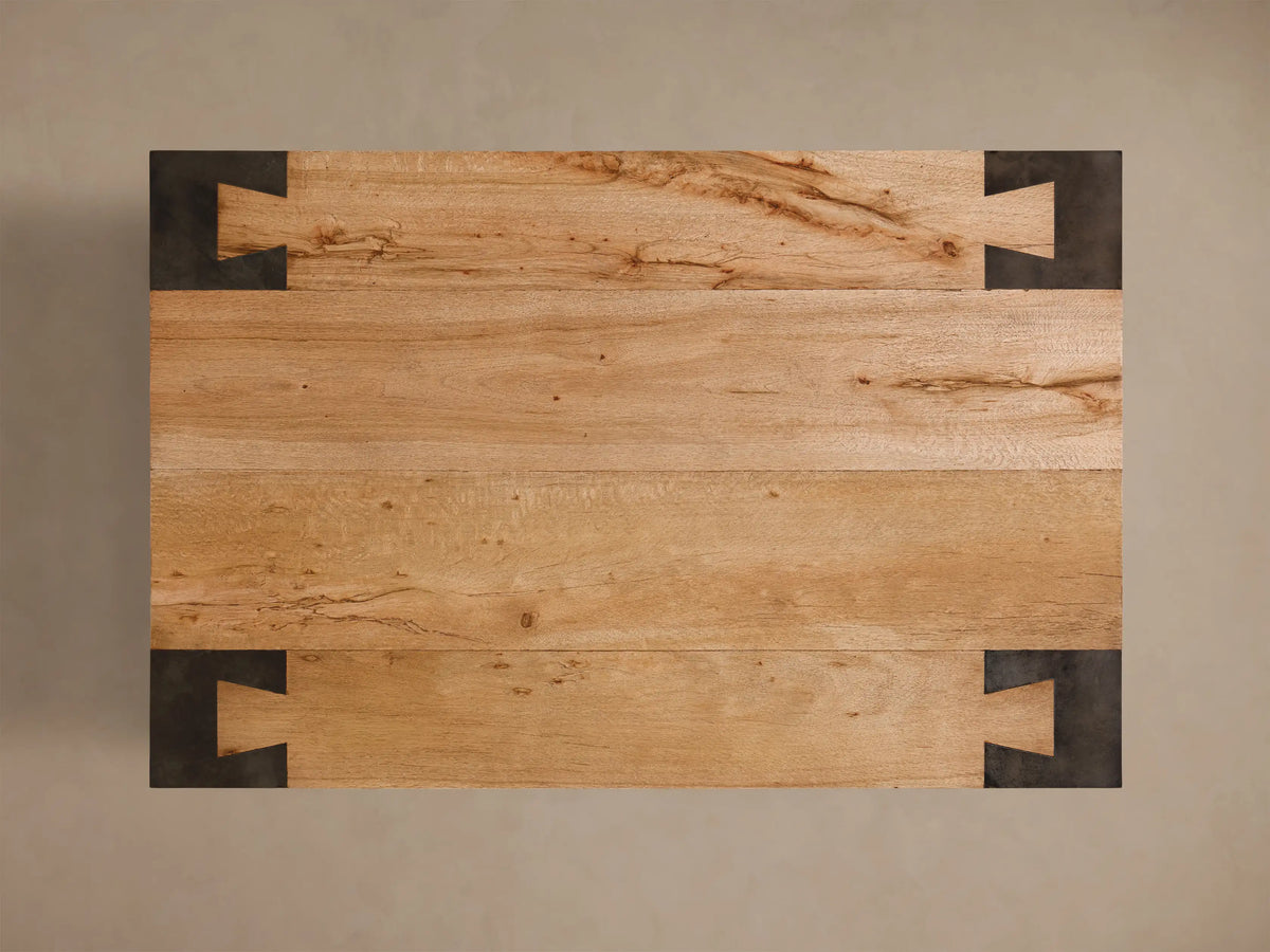 Top-down view of the Telluride Coffee Table‚Ñ¢, featuring light oak wood planks and dark oxidized steel C-shaped corner brackets.