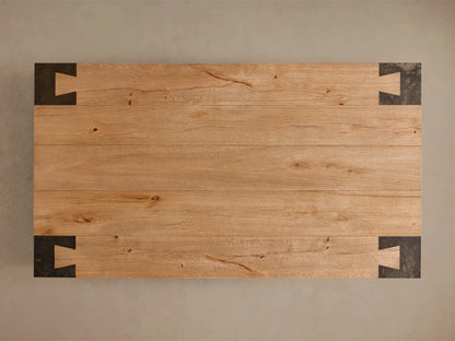 Top-down view of the light brown Telluride Coffee Table, featuring natural oak wood planks and four dark oxidized steel corner accents.