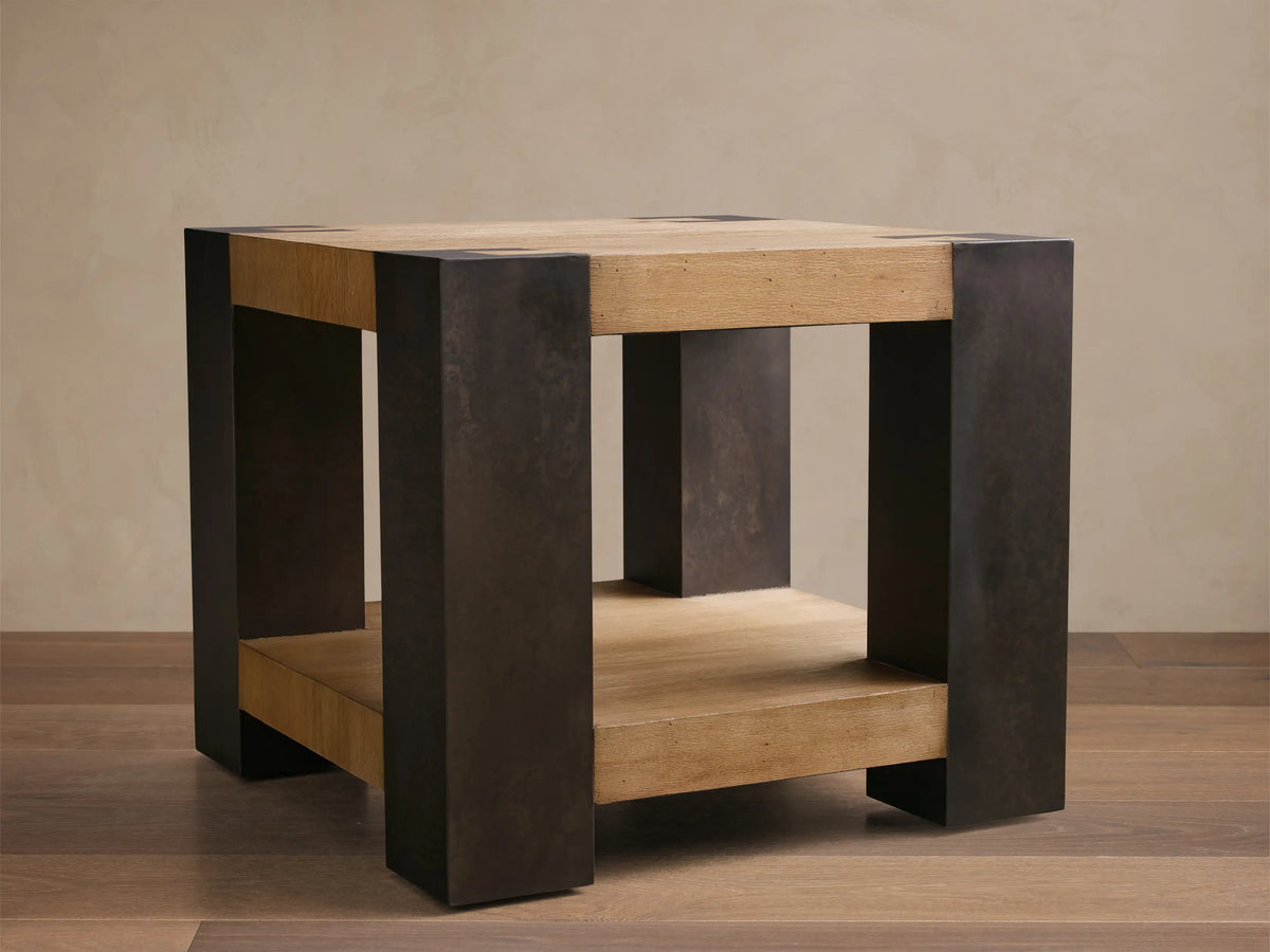 Front view of the Telluride End Table, a square table with light oak wood veneers and dark oxidized steel, featuring a lower shelf.