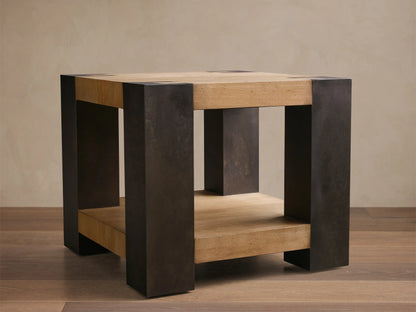 Front view of the Telluride End Table, a square table with light oak wood veneers and dark oxidized steel, featuring a lower shelf.