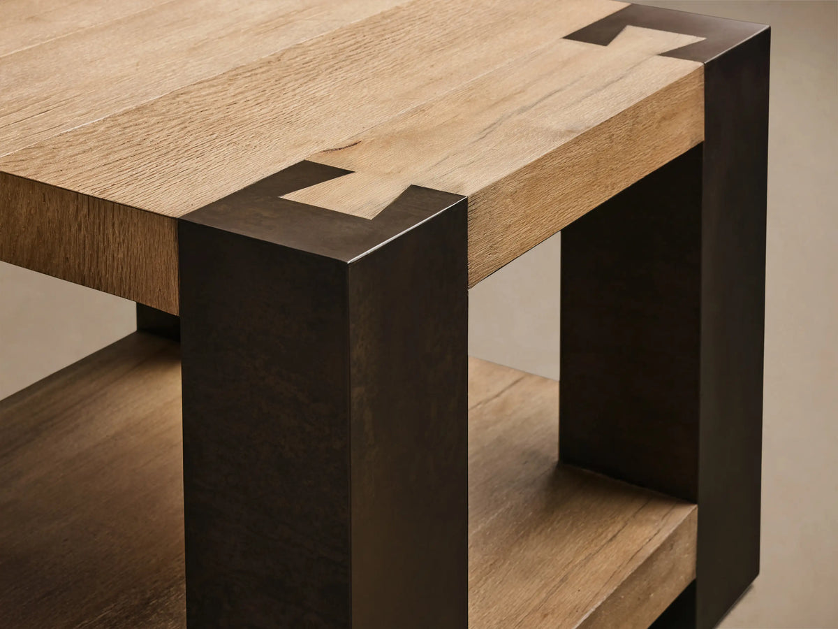Front view of the Telluride End Table, with light oak wood top and shelf, and dark oxidized steel legs.