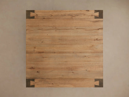 Close-up of the warm toasted oak veneer and dark oxidized steel interlocking corner of the Telluride Square Coffee Table.