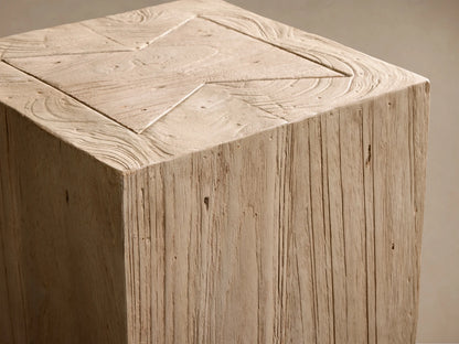 Close-up of the light beige Driftwood Ubud Pedestal, with a geometric top pattern and rustic wood grain.