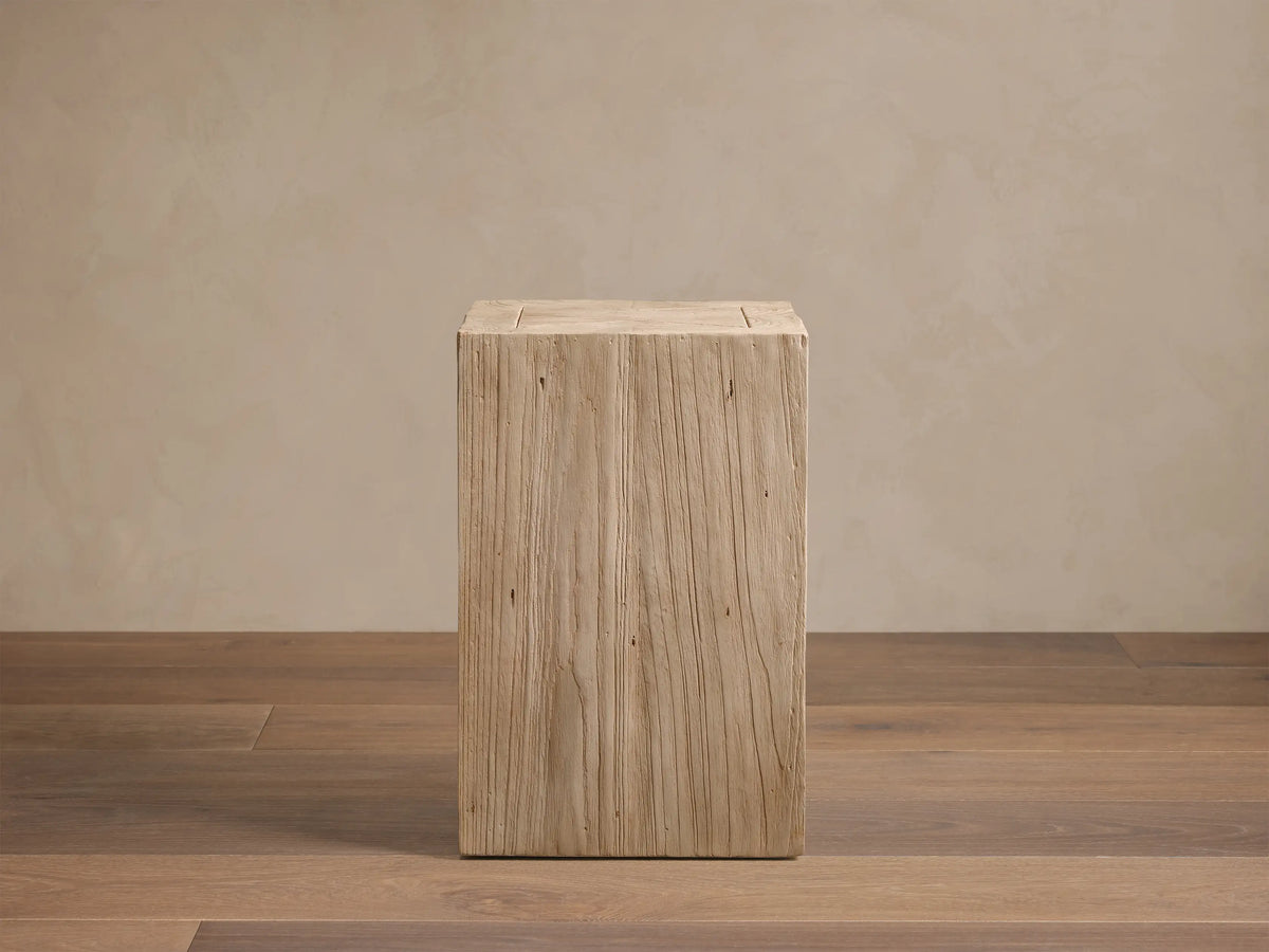 Front view of a light, warm beige Driftwood Ubud Pedestal made from reclaimed teak with rustic texture.