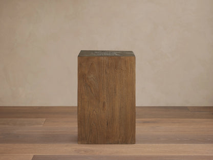 Square Ubud Pedestal made of reclaimed teak wood in a natural waxed finish. Displaying warm brown tones and wood grain texture.