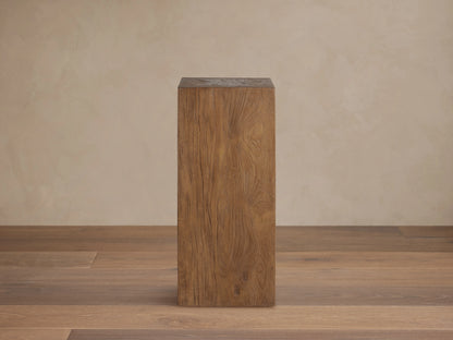 Tall rectangular Ubud Pedestal made of reclaimed teak wood in a warm brown finish. Displays organic textures and unique wood grain.