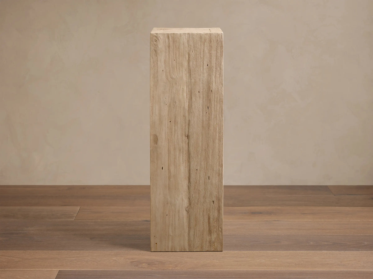 Front view of the light beige Driftwood finish Ubud Pedestal, crafted from reclaimed teak wood, showing natural grain and texture.