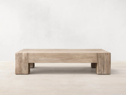 Front view of the light beige Driftwood finish Ubud Coffee Table, showcasing its square shape and reclaimed teak wood texture.