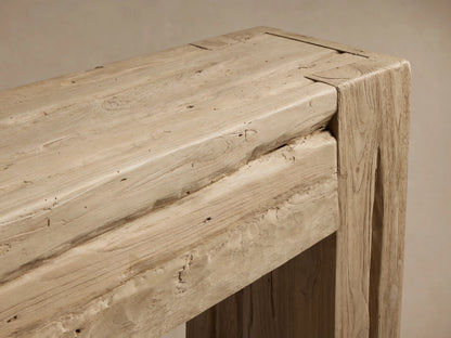 Close-up of the Driftwood finish Ubud Console Table, showing reclaimed teak wood with visible grain and rustic corner joint.
