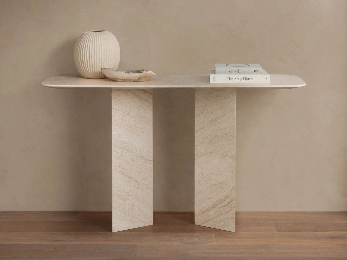 Vesuvius Console Table: Light natural marble console with a rounded rectangular top and two thick, angular panel legs.
