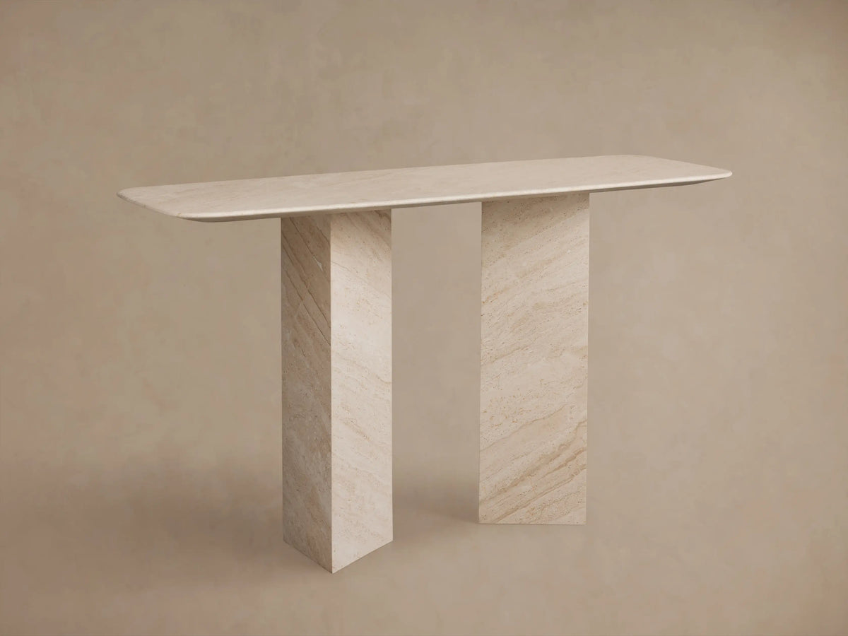 Vesuvius Console Table: Light natural marble console with a rounded rectangular top and two thick, angular panel legs.