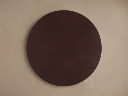 Circular top view of the Volant Leather End Table with a smooth, dark brown leather finish and subtle wood grain texture.