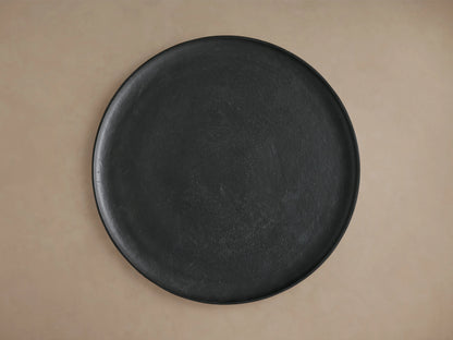 Round Zephyr Martini Table made of dark cast aluminum, featuring a smooth, slightly textured surface, shown from a top view against a neutral background.