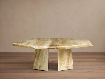 Close-up of the octagonal, asymmetrical green onyx Zyra Round Coffee Table top, with yellowish-green hues and natural white veining.