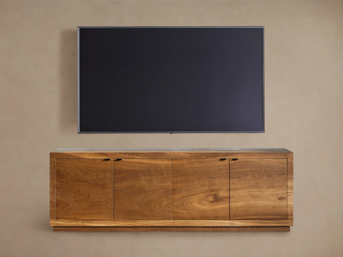 Acacius Media Console made from oxidized steel and reclaimed yukas veneers. Two cabinet doors open, revealing interior shelves.