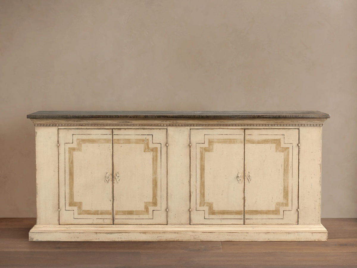 Oriana Buffet, hand-painted distressed off-white cabinet, dark top, four doors with geometric accents & ornate handles.