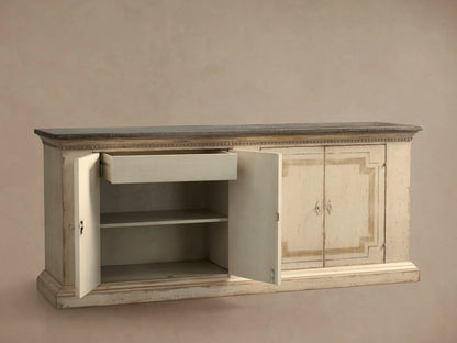 Oriana Buffet: distressed antique white buffet with dark top, two left doors open revealing shelves and a partially open drawer.