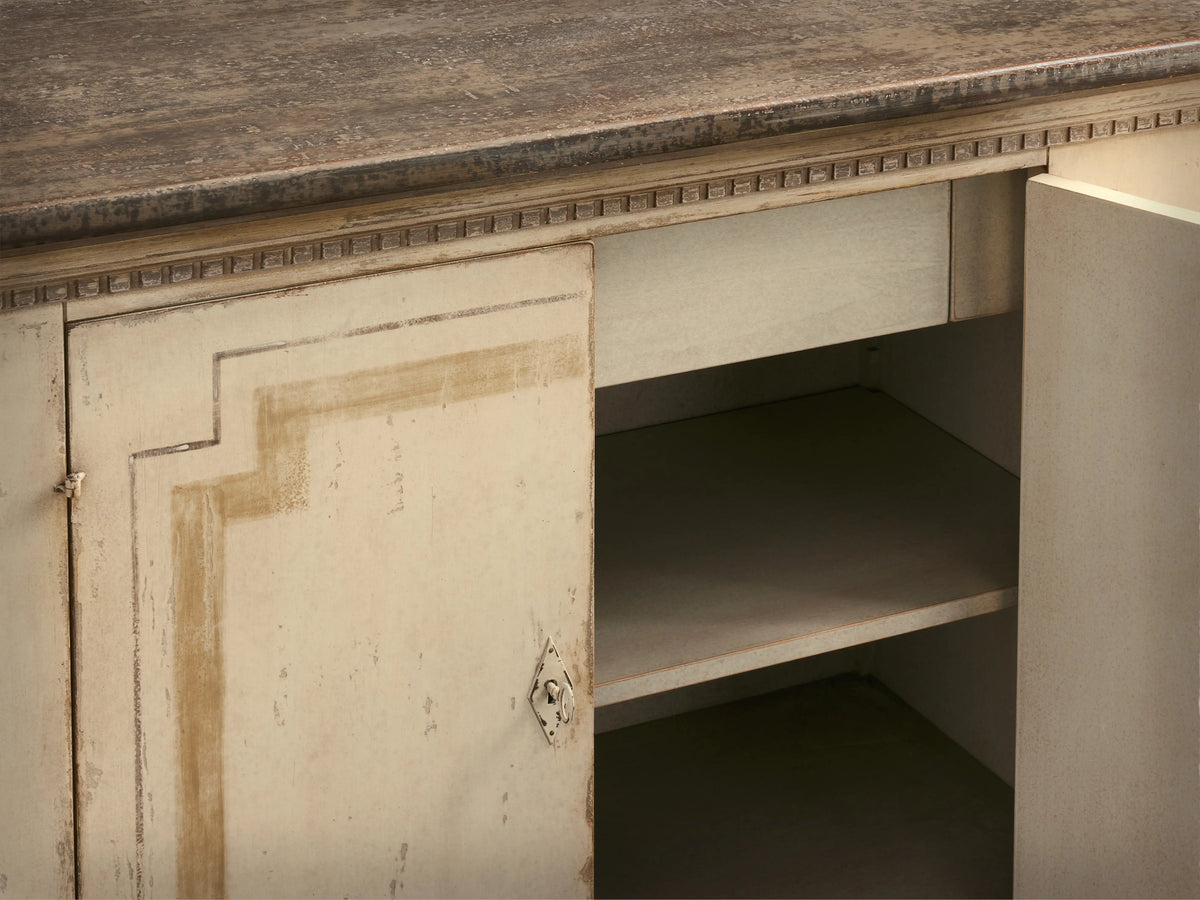 Oriana Buffet, hand-painted distressed off-white cabinet, dark top, four doors with geometric accents & ornate handles.