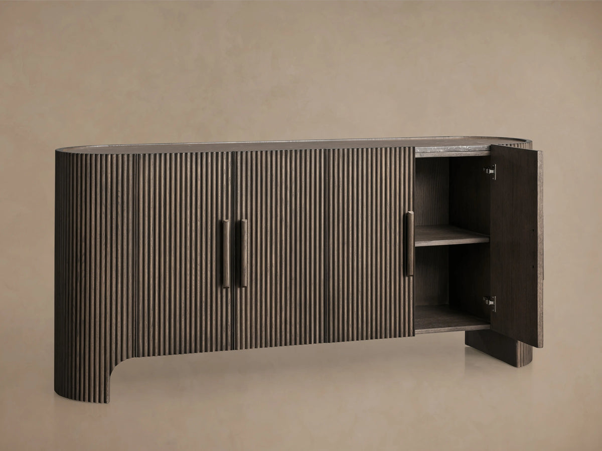 Astor Sideboard with dark oak veneer finish, vertical reeding, soft-close cabinet doors, and wooden pulls against a neutral wall.