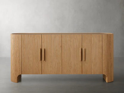 Astor Sideboard with vertical oak wood reeding, four soft-close doors, wooden pulls, and brass accents on a marble top.