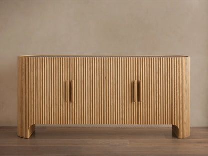 Astor Sideboard with oak veneer and solid oak reeding detail. Inset marble top, soft-close doors with brass-accented wooden pulls.